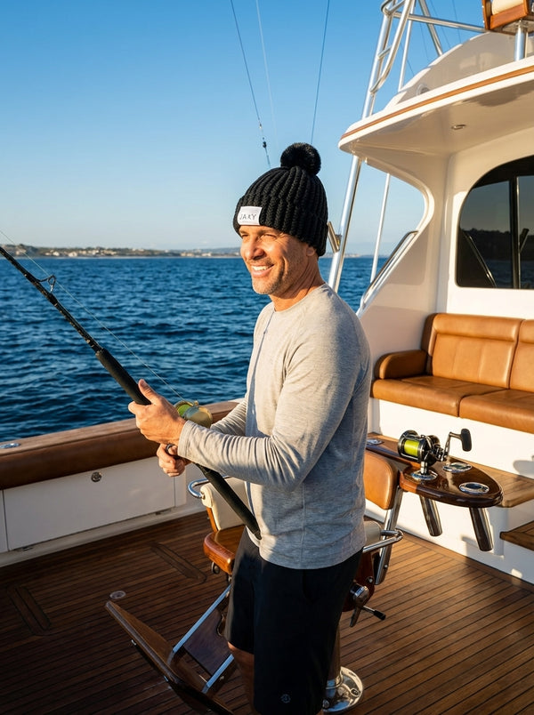 man wearing ebony jaxy beanie on yacht fishing